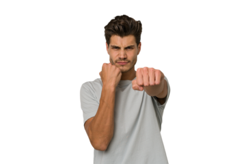 Young handsome caucasian man isolated on white background showing fist to camera, aggressive facial expression.