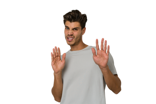 Young handsome caucasian man isolated on white background rejecting someone showing a gesture of disgust.