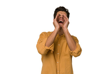 Young handsome caucasian man isolated on white background shouting excited to front.
