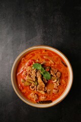 Panaeng pork curry in white plate