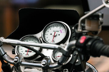 A detailed close-up shot of a motorcycle cockpit, selective focus