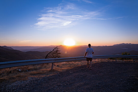 Man standing on top of Sierra Bermeja during sunset, Estepona, Malaga, Spain