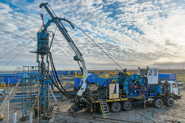 The Northern gas field. Summer. Installation for lowering a flexible pipe into a well. Equipment for testing and development of a gas well