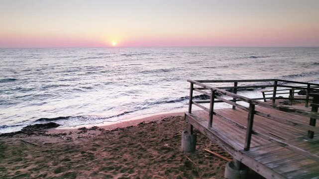 Old Beach Stairs at Sunrise: Soft Waves and Golden Light on Long Beach in Iskele, Northern Cyprus