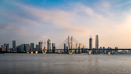Wuhan City Skyline and Yangtze River Bridge at Sunset, China