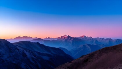 Mountain view with a little mist and a pinkish blue sunset sky