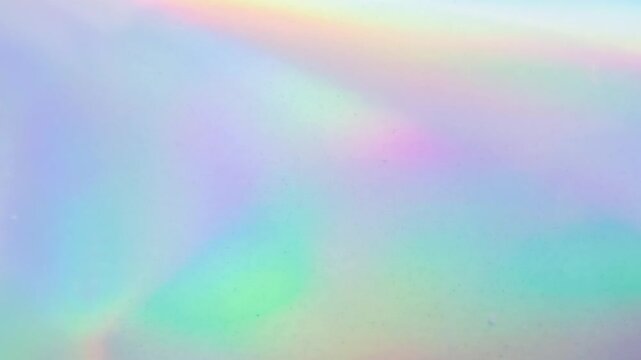 Abstract blur holographic rainbow foil iridescent background stop motion