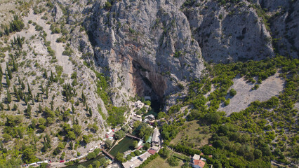 Drone Aerial View of Blagaj Tekija on Cliffside Bosnia and Herzegovina