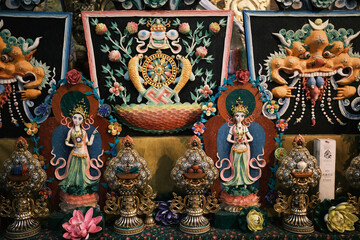Intricate details of Tibetan Buddhist temple interior. Colorful paintings, sculptures, and sacred ornaments symbolizing devotion and Himalayan art heritage