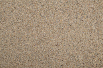 Sand texture seamless background. Uneven sand or natural soil near the sea shore.