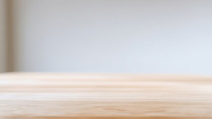 Fototapeta premium A minimalist wooden tabletop with a softly blurred light-toned background, evoking tranquility and purity,