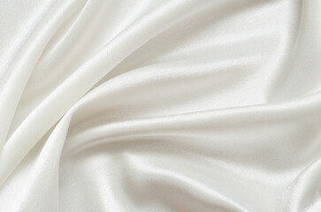 Texture od folded white satin fabric