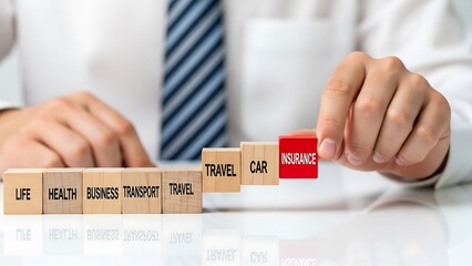 Building insurance with wooden blocks covering all aspects of life