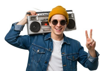 Smiling man in denim jacket and yellow beanie holding a retro boombox and showing a peace sign