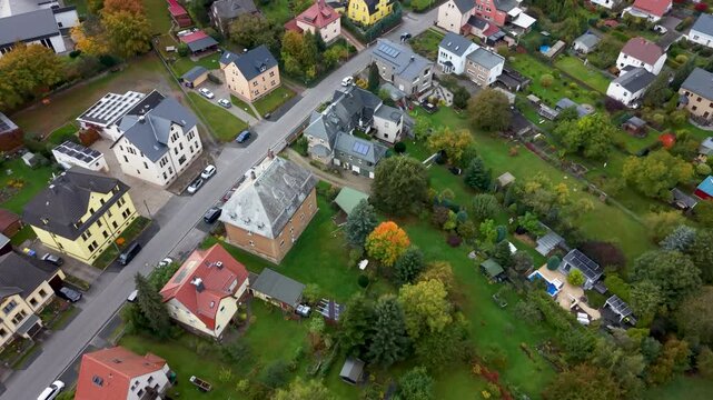 Aerial Freiberg Germany homes city valley 1 4K. City center rural travel in eastern Germany. Historical buildings and landmarks. Urban historic center of East Germany. Total destruction in WW II.