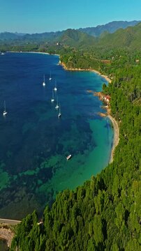  Aerial view of Fort Bregancon sunset aerial view from the mediterranean sea. A yacht is anchored near the fortress