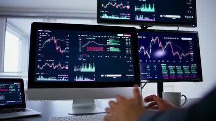 Analyzing Stock Market Trends on Multiple Screens for Investment Decisions.