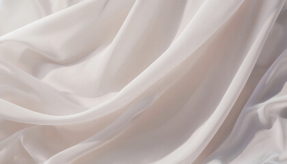 The abstract background is a drapery of weightless, translucent textiles with soft, deep folds. The glossy material creates a soothing undulating pattern.