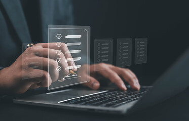 Businessman using laptop with digital checklist and signature on virtual document, concept of online form approval, task management, and paperless workflow in modern business technology.
