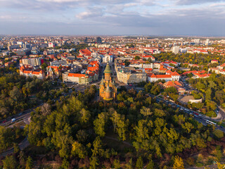 Aerial view of Timisoara city center with the Orthodox Metropolitan Cathedral and Bega River at sunset, Romania