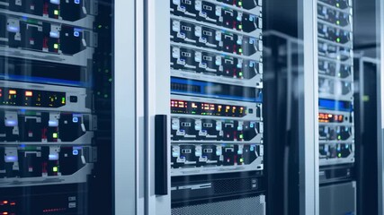 This video displays high-tech data servers arranged in a modern data center, featuring advanced networking equipment, secure infrastructure, and cutting-edge technology powering digital information st - Powered by Adobe