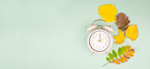Autumn time change, end of daylight saving time, alarm clock fall back switch, colorful foliage,...
