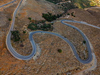 Winding road through the rugged landscape of southern Crete captures the essence of scenic beauty and adventure