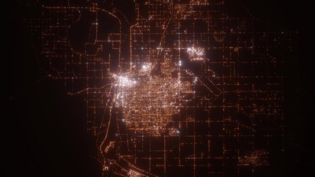 Yuma (Arizona, USA) top view at night. Aerial view on modern city from space. Camera is flying above the city, moving forward. Vertical video. The north is on the left side