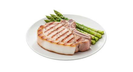 Isolated grilled pork chop with asparagus on plate close-up, healthy and balanced meal