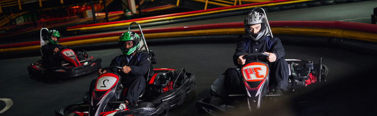 Exciting kart racing adventure in an indoor leisure facility with friends enjoying speed