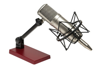 Isolated silver metal microphone in shock mount on a wooden base for podcast or recording studio