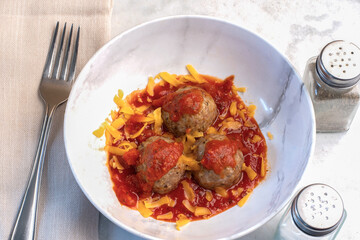 meat balls in pasta  sauce and cheese