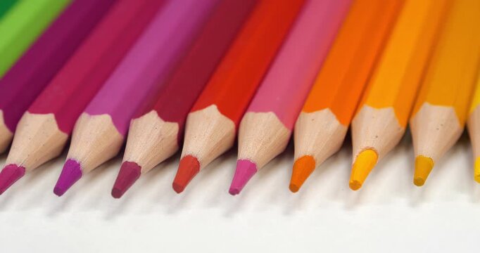 Beautiful new pencils of different colors. Multi-colored pencils of rainbow colors