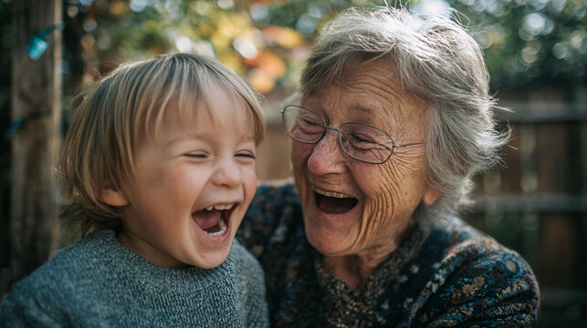 Heartwarming moment of pure joy as grandma and grandson share laughter in natural light, perfect for family values campaigns and intergenerational stories