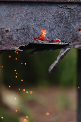Sparks are flying out of an old, rusty, burnt-out metal grill - the damaged grill needs to be updated
