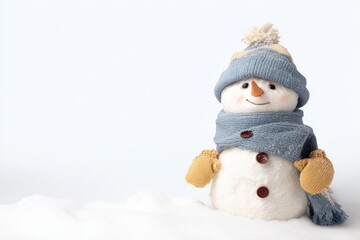 Obraz premium Festive Snowman Decoration with Blue Hat and Scarf Isolated on White Background, Winter Holiday Season