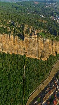  Mornas Fortress stands majestically on top of a rocky cliff. The Fortress of Mornas is a medieval fortress above the village of the same name in the French department of Vaucluse