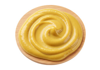 Isolated swirl of yellow mustard on a wooden plate is ready to top delicious food items