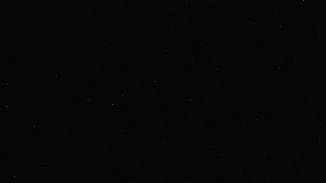 Shooting stars or meteor shower in the rotating dark star field. 4K space motion background
