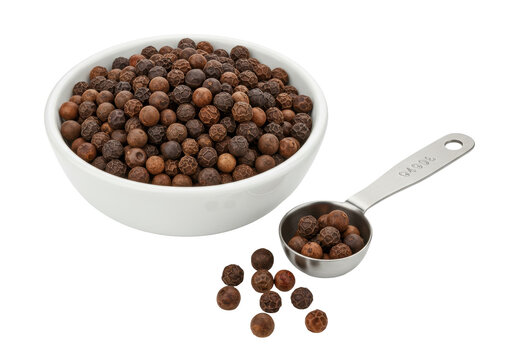Isolated black peppercorns spice ingredient in white bowl with teaspoon, cooking flavour