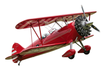 Isolated old red biplane with stripes and propeller at an angle, airshow demonstration