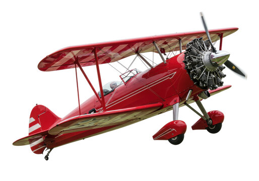 Isolated old red biplane with stripes and propeller at an angle, airshow demonstration