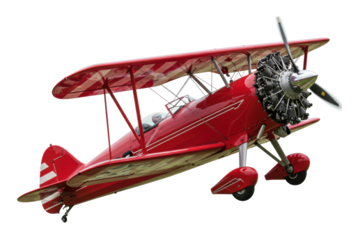 Isolated old red biplane with stripes and propeller at an angle, airshow demonstration
