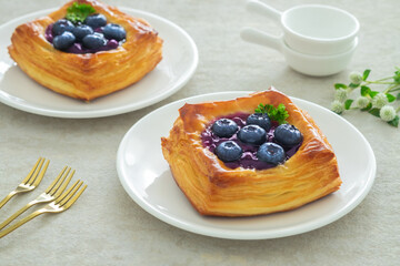 Blueberry danish puff pastry on white plate