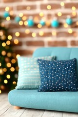 Stylish turquoise sofa with patterned pillows and glowing bokeh lights in cozy festive interior