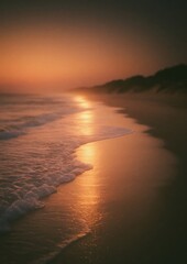 Fototapeta premium Serene beach sunset with golden hues reflecting on gentle waves