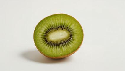 Sliced kiwi fruit isolated on white background, revealing bright green core and fine seed details with realistic shadow.