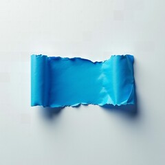 a piece of blue torn paper on white background