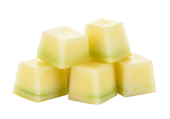 Isolated cube pieces of ripe honeydew melon ready to eat as refreshing summer snack food