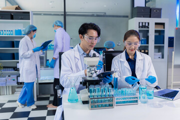 Lab work, Doctor holds a test tube takes the test from a test tube in analysis, blood, DNA, test tube stand.